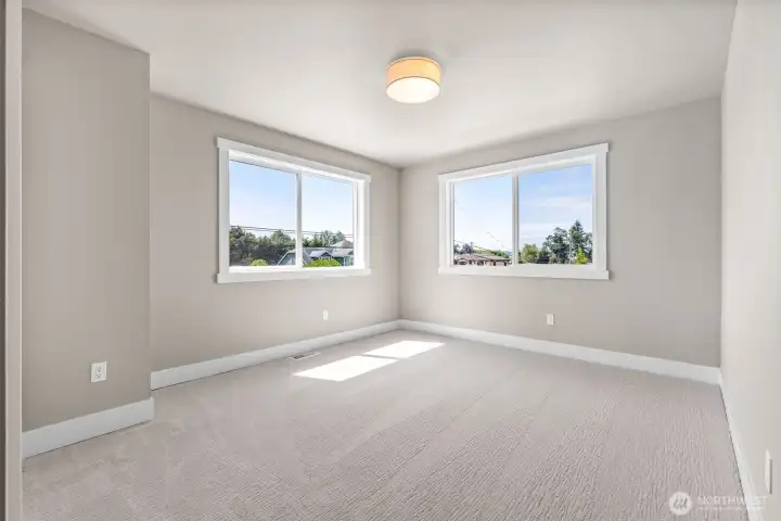 Additional bedrooms are generously sized and enjoy a partial view as well.