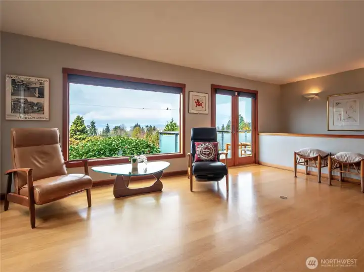 Living room with wood wrapped windows and beautiful views!