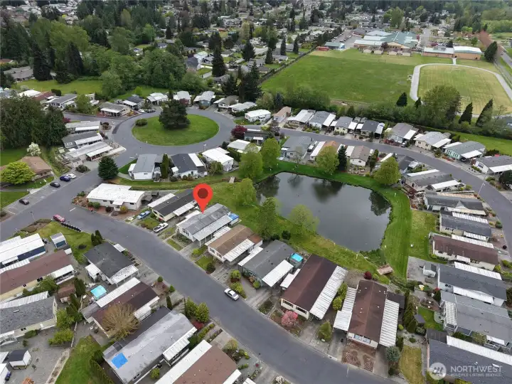 This home is located right on the pond, with views from the primary suite.