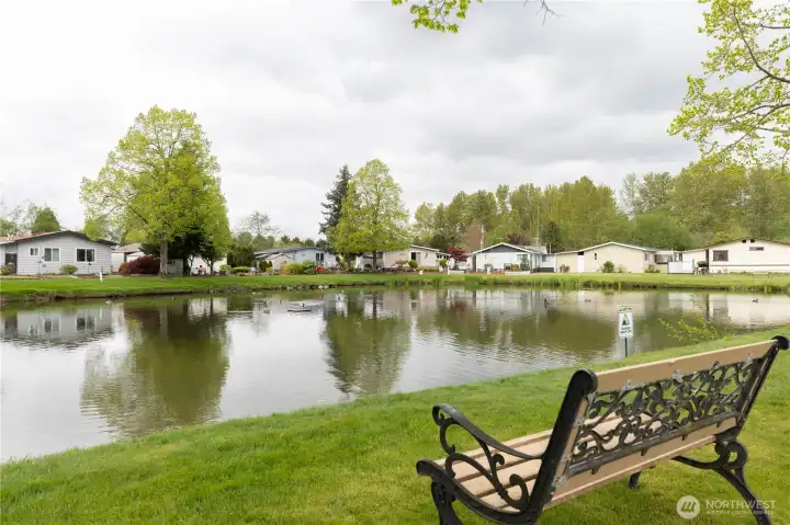 Just steps from the back porch youll be able to relax and watch the birds at the pond.