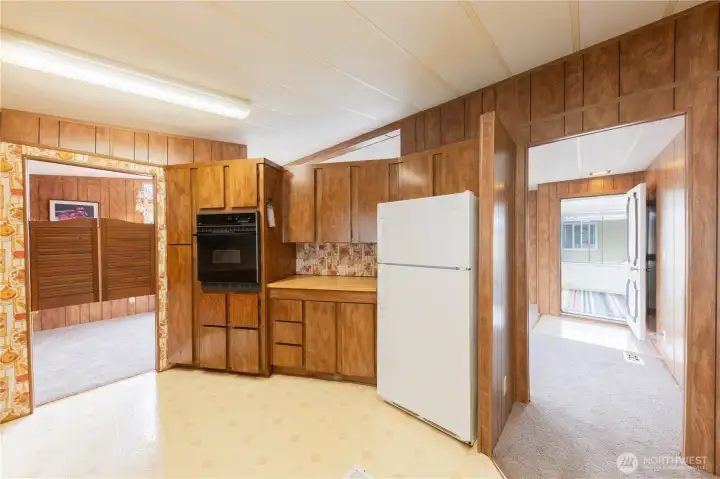 Right off the large kitchen you'll find the formal living room.