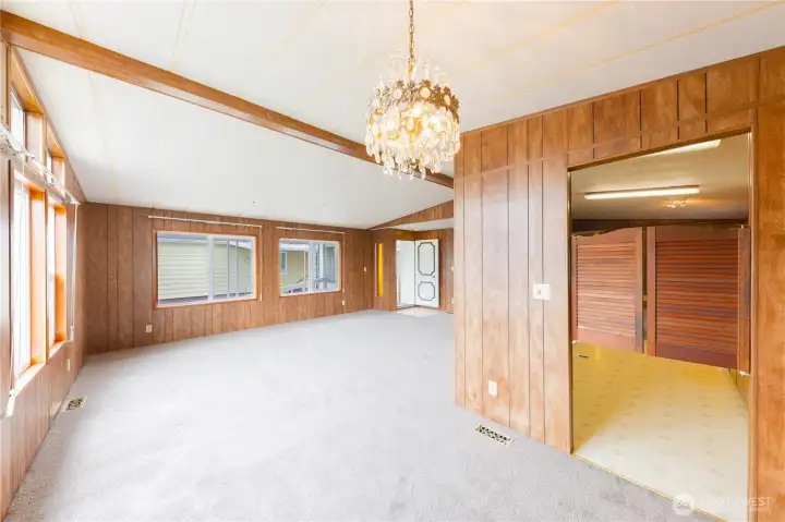 Large windows make the living room and dining room bright and welcoming.