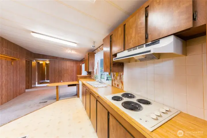 also off of the kitchen you'll find the informal dining area with access to the covered deck.