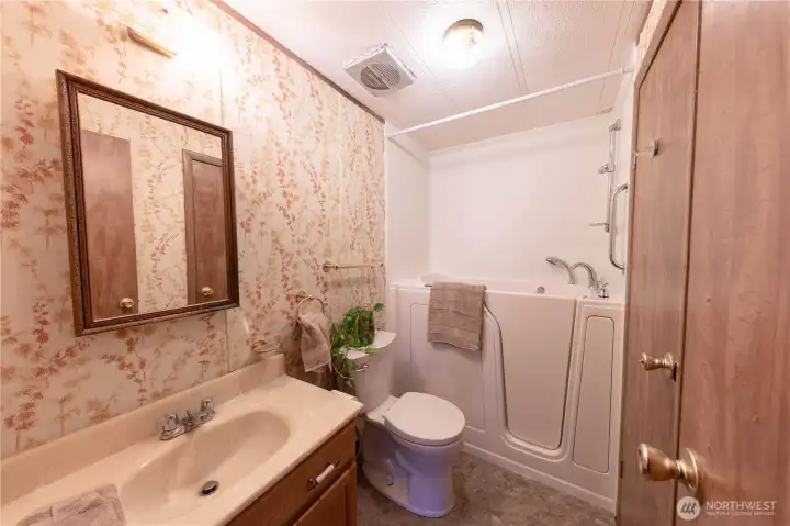 The full bathroom is located across from the other 2 bedrooms.