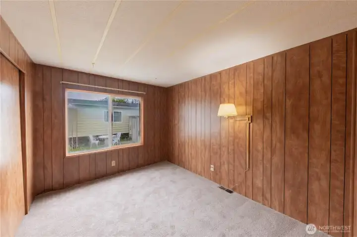 The third bedroom also has a large window, offering lots of light and warmth to the space.