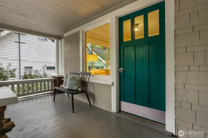 Welcoming front porch.  Relax and enjoy this peaceful neighborhood.