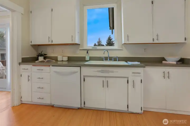 Efficient kitchen with a perfectly placed window—enjoy ever-changing skies while you prepare meals.