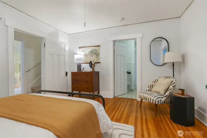 Primary bedroom with direct access to the main floor bathroom.