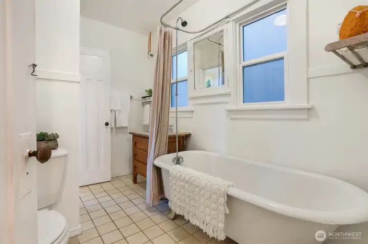 Unwind in this classic clawfoot tub—your perfect end-of-day treat!