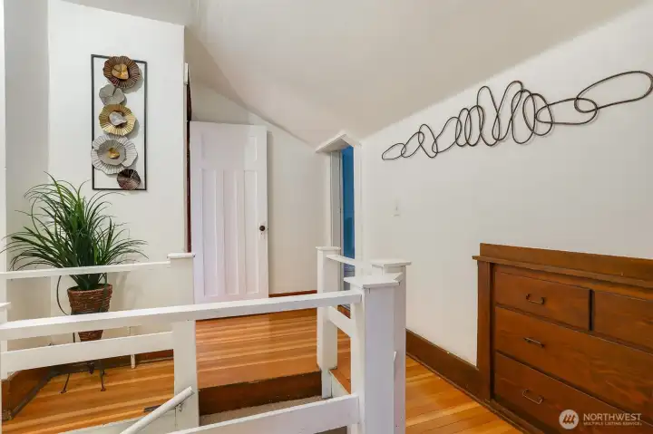 Upstairs landing.  Hardwood floors grace the majority of the top two levels of this home.