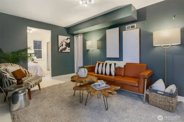 Partially finished lower level featuring a rec room/family room and a bedroom, with additional space in the unfinished half of the basement offering room to expand.