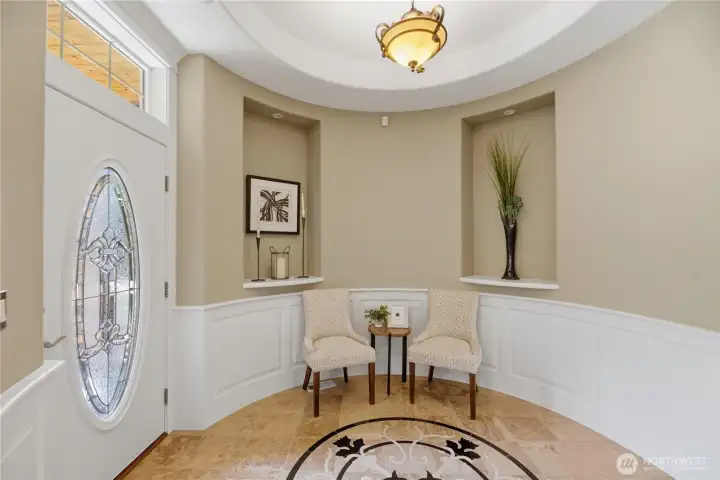 Refined architectural details including rounded corners and custom wainscoting, rarely found at this price point.