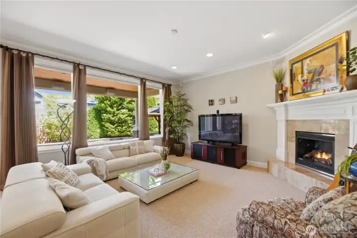 Oversized windows and soaring 10-foot ceilings provide abundant natural light throughout.