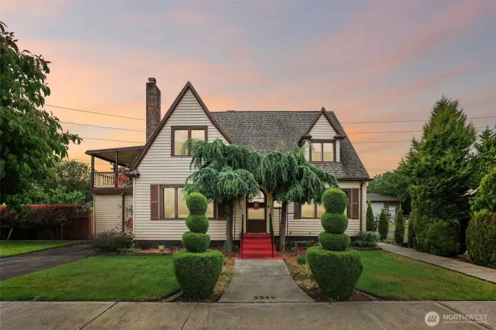 Gorgeous 1929 3 story Tudor Revival with 3 car detached garage & abundant charm!