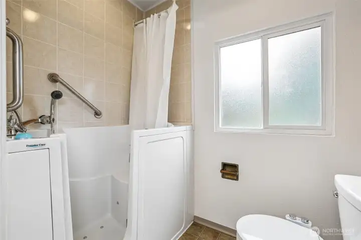 The bathroom also has a bidet toilet & walk-in tub/shower-ideal for multi generational living.