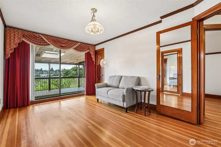This room is very spacious plus it has a sliding glas door that leads out to the large covered deck & the gorgeous view of Mt. Rainier!