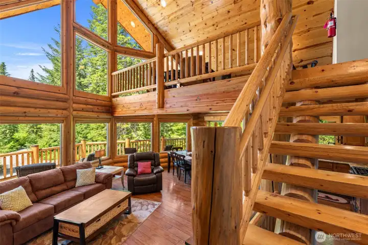 Main Floor Great Room with Picture Windows, Vaulted Ceiling and Open Stairs