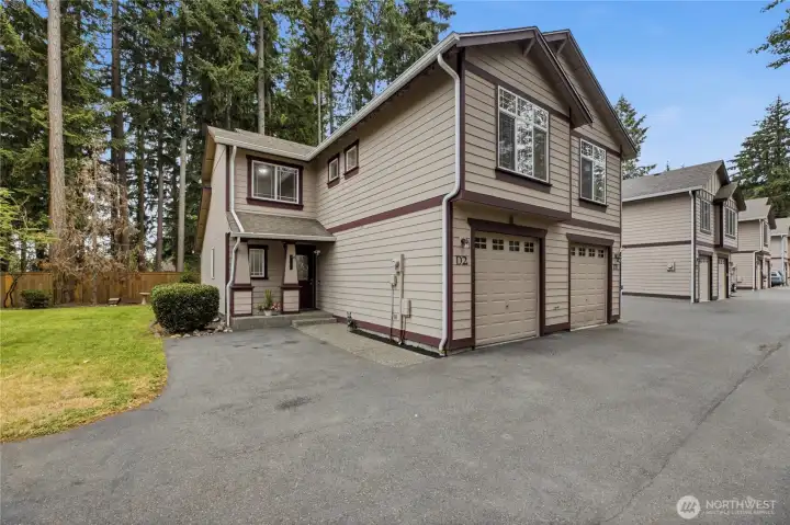 Welcome Home! Charming front exterior of this beautifully positioned end-unit townhome-style condo.