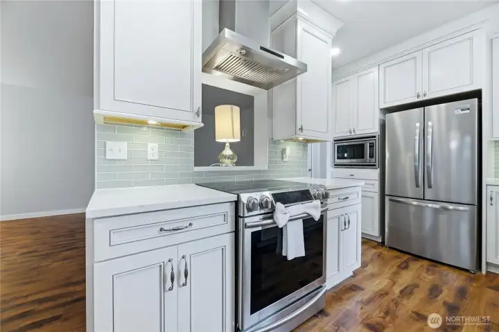 Premium KraftMaid soft-close cabinets and drawers, including convenient pull-out drawers for effortless organization.