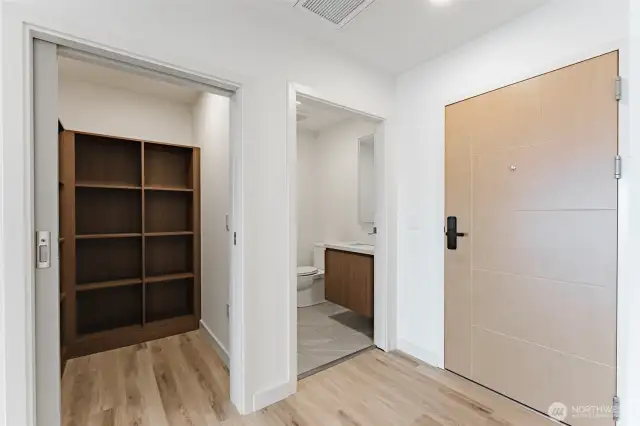 Entry half bath and pantry.