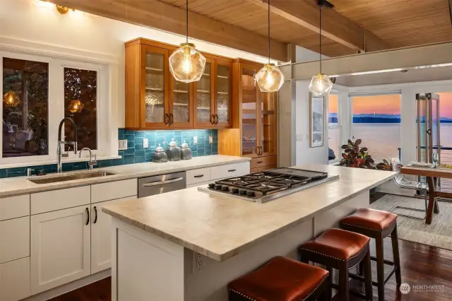 Sweet kitchen with ample counter space and cabinetry. The exposed beams add to the charm of the space.