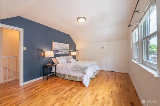 Primary bedroom with large closet on upper floor