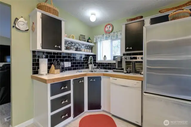 Tile backsplash was also done on this wall behind the sink.