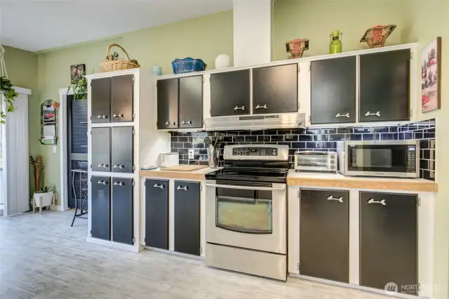 Tucked between the sliding door and the cabinetry is the utility room.
