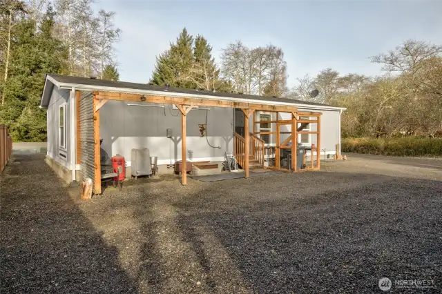 The rear of the home has a 220 outlet for a hot tub, a covered patio area and catio.