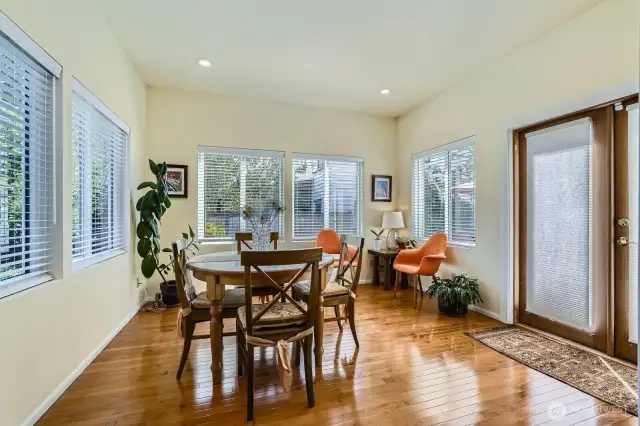Currently used as a dining room, this could be a media space, or sunroom...