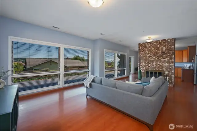 Large recreation room on lower level features a second kitchen, 3/4 bath, gas fireplace, and separate w/d unit which provide for flexible living and MIL potential.