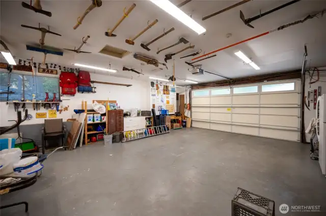 Two car garage / workshop plus additional guest parking by lower entrance. 158th Lane is a private road that accesses in or out onto 41st Avenue through a private gate.