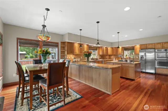 The chef is never alone in this kitchen.  They can be part of all activities in this open concept home.  There is plenty of room for people to sit and enjoy a meal, watch the chef, or add bar stools in front of the counter