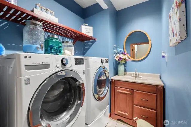 Located next to Primany Bedroom. This  is one of two washer and dryers that stay with the home