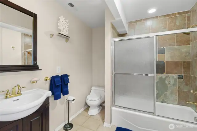 A full bath is located in the Bonus Room.  Notice gold fixtures