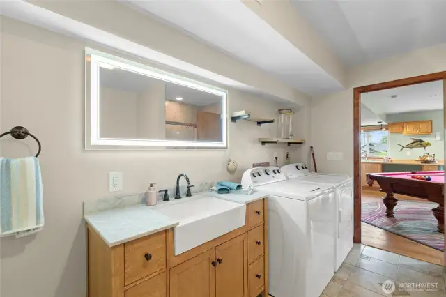 The 2nd laundry area is located in the daylight basement .  The washer and dryer stay with the home