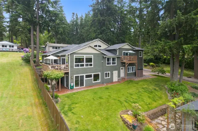 Sliding doors open to lake and privide access to the potential private multi -gen or additional living space. The other doors lead to the mechanical room (where two furnaces and fire suppression system are located) and garage
