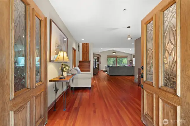 Entry doors open to treat you to the wonderful Brazilian cherry hardwood floors that run throughout the entire main level