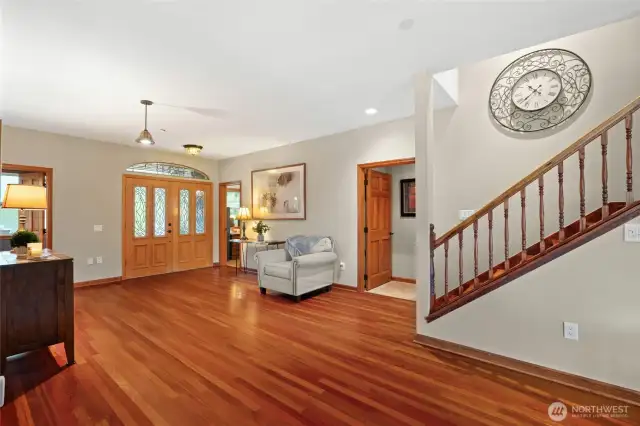 Looking back  toward the grand entry doors. The office and powder room are located to the left and right of the doors