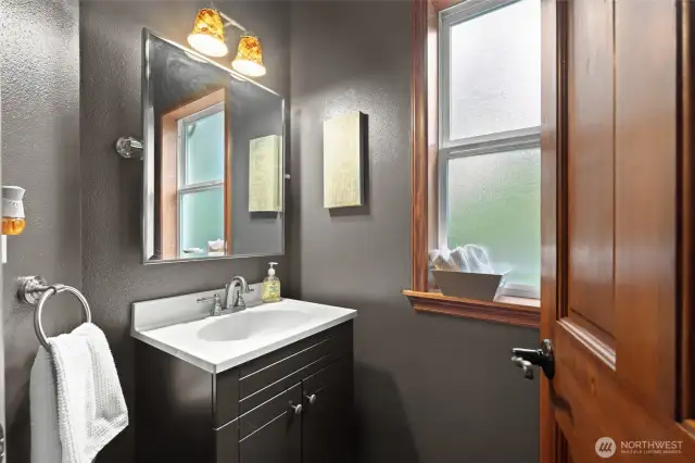 The Powder Room is located  near the kitchen and front entrrance