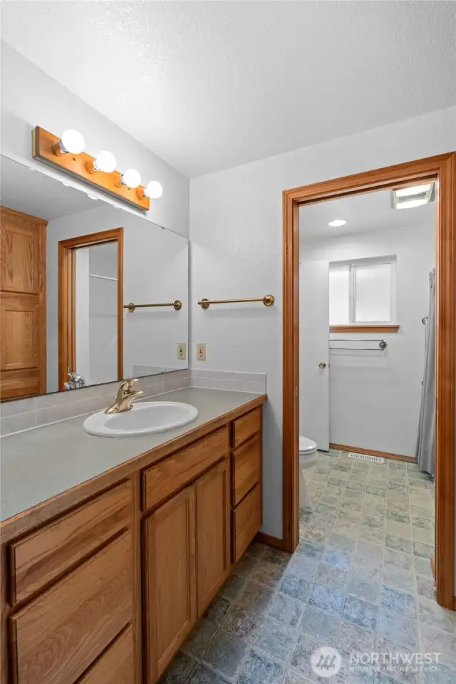 Primary bathroom has second door from hall and can double as a second guest bath.