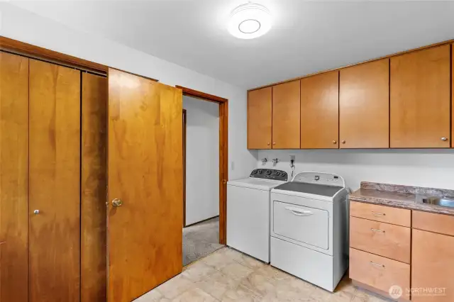 Conveniently located laundry room doubles as a mud room off back porch.