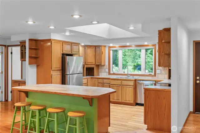 Light filled spacious kitchen with island/breakfast bar.