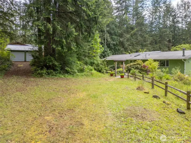 Front parking area and driveway to detached 2 car garage/shop.