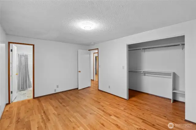 Second view of primary bedroom with private bathroom.