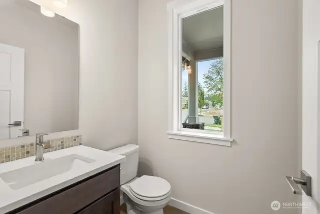Main floor half bath, ideal for guests.