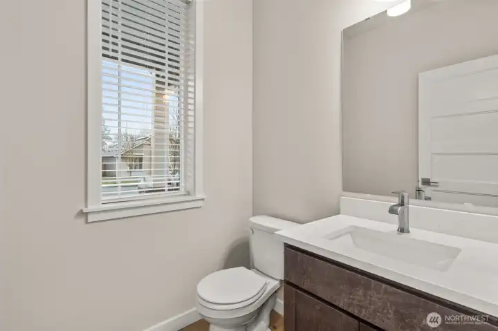 Main floor half bath, perfect for guests.