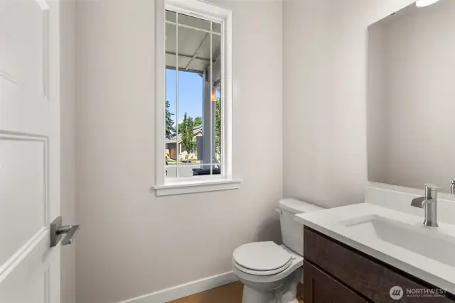 Main floor half bath, perfect for guests.