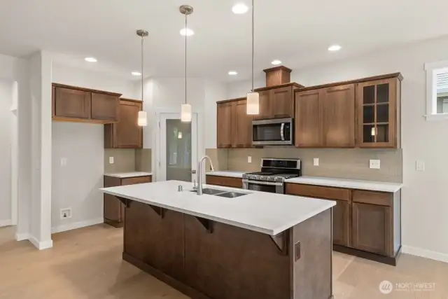 Beautiful Maple cabinets and quartz countertops throughout home-photo from similar home for reference only. Actual cabinet color will be Charcoal (see photo #10)