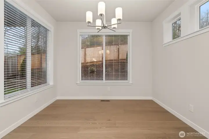 Lovely dining nook with tons of natural light flowing through.